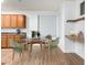 Cozy dining area next to kitchen with a round table and green chairs at 16183 W Devonshire Ave, Goodyear, AZ 85395