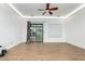 Open-concept living room boasting hardwood floors and recessed lighting at 16183 W Devonshire Ave, Goodyear, AZ 85395