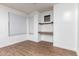 Bright, empty room with built-in desk and shelving, ready for personalization at 16183 W Devonshire Ave, Goodyear, AZ 85395