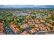 Scenic aerial view featuring a lake, community pool, and meticulously maintained landscaping at 1633 E Lakeside Dr # 98, Gilbert, AZ 85234