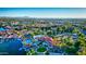 Expansive community aerial with lake, lush landscaping, waterfall feature and recreational amenities at 1633 E Lakeside Dr # 98, Gilbert, AZ 85234