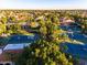 Aerial view of multiple tennis courts and houses in the neighborhood at 1633 E Lakeside Dr # 98, Gilbert, AZ 85234