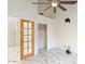 Bright bedroom with high ceilings, fan, and closet at 1633 E Lakeside Dr # 98, Gilbert, AZ 85234
