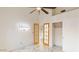 Bright bedroom features vaulted ceilings, ceiling fan, and modern doors at 1633 E Lakeside Dr # 98, Gilbert, AZ 85234