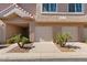 Front exterior showcasing the unit's garage with a lovely facade and low-maintenance landscaping at 1633 E Lakeside Dr # 98, Gilbert, AZ 85234