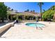 Private outdoor hot tub with tiled patio, landscaping and a view of the clubhouse at 1633 E Lakeside Dr # 98, Gilbert, AZ 85234