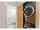 Modern laundry area with new stackable washer and dryer and storage at 1633 E Lakeside Dr # 98, Gilbert, AZ 85234