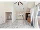 Bright living room featuring marble floors, tall ceilings, lots of windows, and dark cabinets at 1633 E Lakeside Dr # 98, Gilbert, AZ 85234