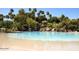 A large, lagoon-style pool featuring rock waterfalls and a gazebo at 1633 E Lakeside Dr # 98, Gilbert, AZ 85234