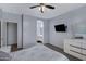 Well-appointed main bedroom featuring neutral tones, a ceiling fan, and an en-suite bathroom at 1650 S Crismon Rd # 86, Mesa, AZ 85209