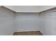 This walk-in closet with wood clothing racks offers ample storage at 1650 S Crismon Rd # 86, Mesa, AZ 85209