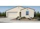 Charming single-story home with neutral stucco, a two-car garage, and a well-manicured desert landscape at 16683 W Hackamore Dr, Surprise, AZ 85387