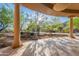 A covered back porch with a tiled floor and exterior views at 16716 S 32Nd Ln, Phoenix, AZ 85045