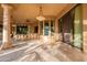 An expansive covered patio with pillars and views of the desert landscape at 16716 S 32Nd Ln, Phoenix, AZ 85045