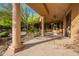 A shaded patio with stone columns and tiled floor at 16716 S 32Nd Ln, Phoenix, AZ 85045