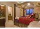 Comfortable bedroom with a four-poster bed, cozy bedding, and views to the ensuite creates a relaxing retreat at 16716 S 32Nd Ln, Phoenix, AZ 85045