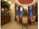 Formal dining room boasts bay windows with views, elegant furnishings, and a sophisticated ambiance for memorable meals at 16716 S 32Nd Ln, Phoenix, AZ 85045