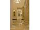 Grand hallway features decorative tile flooring, columns, and an arched entry, creating an elegant and inviting space at 16716 S 32Nd Ln, Phoenix, AZ 85045