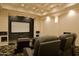 A home theater features tiered seating, a large screen, and custom lighting at 16716 S 32Nd Ln, Phoenix, AZ 85045