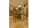 Spacious kitchen features an island with barstool seating, custom cabinets, and decorative light fixtures at 16716 S 32Nd Ln, Phoenix, AZ 85045