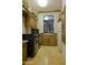 Functional laundry room has a washing machine, dryer, sink, and ample cabinetry, making chores more efficient and organized at 16716 S 32Nd Ln, Phoenix, AZ 85045
