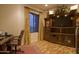 Home office with custom wooden built-in cabinets and large window with attractive draperies at 16716 S 32Nd Ln, Phoenix, AZ 85045