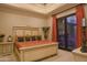 Cozy main bedroom features a comfortable king-sized bed, decorative lamps, and a private outdoor area for relaxing moments at 16716 S 32Nd Ln, Phoenix, AZ 85045
