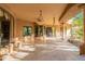 Spacious covered patio features tile flooring, arched openings, and ample space for outdoor living at 16716 S 32Nd Ln, Phoenix, AZ 85045
