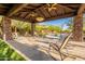 Beautiful backyard oasis with a sparkling pool, stone accents, and an inviting covered patio area at 16716 S 32Nd Ln, Phoenix, AZ 85045