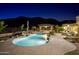 Pool at night with desert landscaping and mountain views at 16716 S 32Nd Ln, Phoenix, AZ 85045