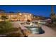 Backyard view of the pool and spa with desert landscaping and mountain views at dusk at 16716 S 32Nd Ln, Phoenix, AZ 85045