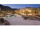 Stunning backyard with a lagoon-style pool, stone accents, and covered patio, perfect for outdoor entertaining at 16716 S 32Nd Ln, Phoenix, AZ 85045