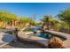 Inviting backyard pool and spa area featuring desert landscaping and a luxurious outdoor living space at 16716 S 32Nd Ln, Phoenix, AZ 85045
