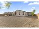 Expansive backyard with desert landscaping, outdoor furniture and mature trees at 1749 W Posada St, Coolidge, AZ 85128