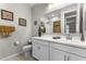 Well-lit bathroom with a double vanity, a large mirror, and decorative accents at 1749 W Posada St, Coolidge, AZ 85128