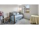 Comfortable bedroom with a daybed, pillows, and soft carpet at 1749 W Posada St, Coolidge, AZ 85128