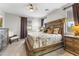 Spacious bedroom with a large bed, decorative pillows, and side tables at 1749 W Posada St, Coolidge, AZ 85128