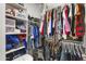 Organized walk-in closet with shelves, drawers, and hanging rods at 1749 W Posada St, Coolidge, AZ 85128
