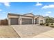 The home features a well-manicured desert landscape, a three-car garage, and an inviting, arched entryway at 1749 W Posada St, Coolidge, AZ 85128