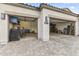 Exterior view of a two-car garage with wide driveway at 1749 W Posada St, Coolidge, AZ 85128