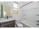 This bathroom features a marble vanity countertop and shower-tub combo at 18564 W Cathedral Rock Dr, Goodyear, AZ 85338