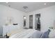 This bedroom features an ensuite bathroom, walk-in closet, and modern dresser at 18564 W Cathedral Rock Dr, Goodyear, AZ 85338