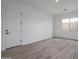 Bright bedroom featuring light walls, tile floors, and a window at 18564 W Cathedral Rock Dr, Goodyear, AZ 85338