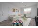 Inviting living room area offers a bright space with a white couch and colorful decor at 18564 W Cathedral Rock Dr, Goodyear, AZ 85338