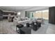 Tastefully furnished living space with tile floors, sliding glass doors, and a kitchen in the background at 18564 W Cathedral Rock Dr, Goodyear, AZ 85338