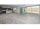 Open-concept living space featuring tile floors, large sliding doors, and a kitchen with a center island at 18564 W Cathedral Rock Dr, Goodyear, AZ 85338