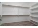Walk-in closet with built-in shelving and hanging rods, offering ample storage space at 18564 W Cathedral Rock Dr, Goodyear, AZ 85338
