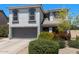 Charming two-story home featuring a grey facade, well-maintained landscaping, and a two-car garage at 1870 E Oakland St, Gilbert, AZ 85295