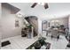 Open-concept living area with tile floors, stairs to the second level and natural light, ideal for Gathering gatherings at 1870 E Oakland St, Gilbert, AZ 85295