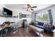 Charming living room with hardwood floors, a ceiling fan, and a comfortable seating area, great for relaxing and entertaining at 1870 E Oakland St, Gilbert, AZ 85295